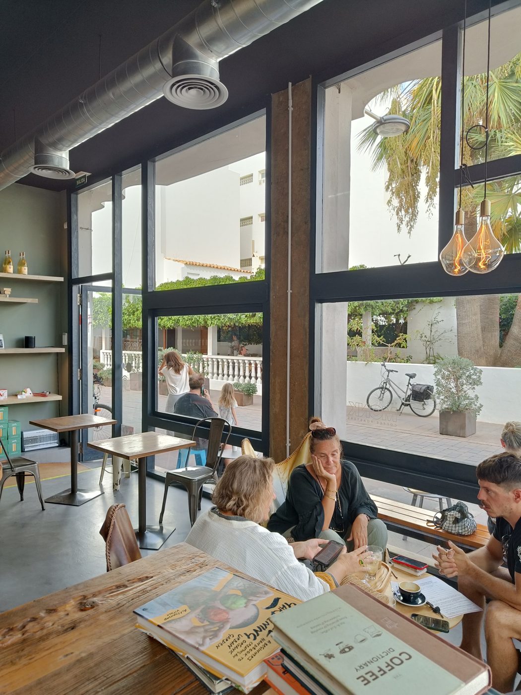 People talking around a café table